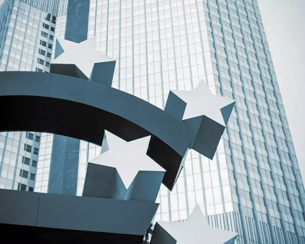 Euro currency symbol sculpture with stars in front of the European Central Bank building in Frankfurt, Germany