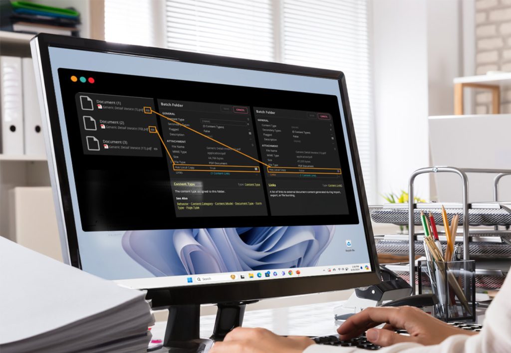 Desktop monitor showing intelligent document processing software processing documents